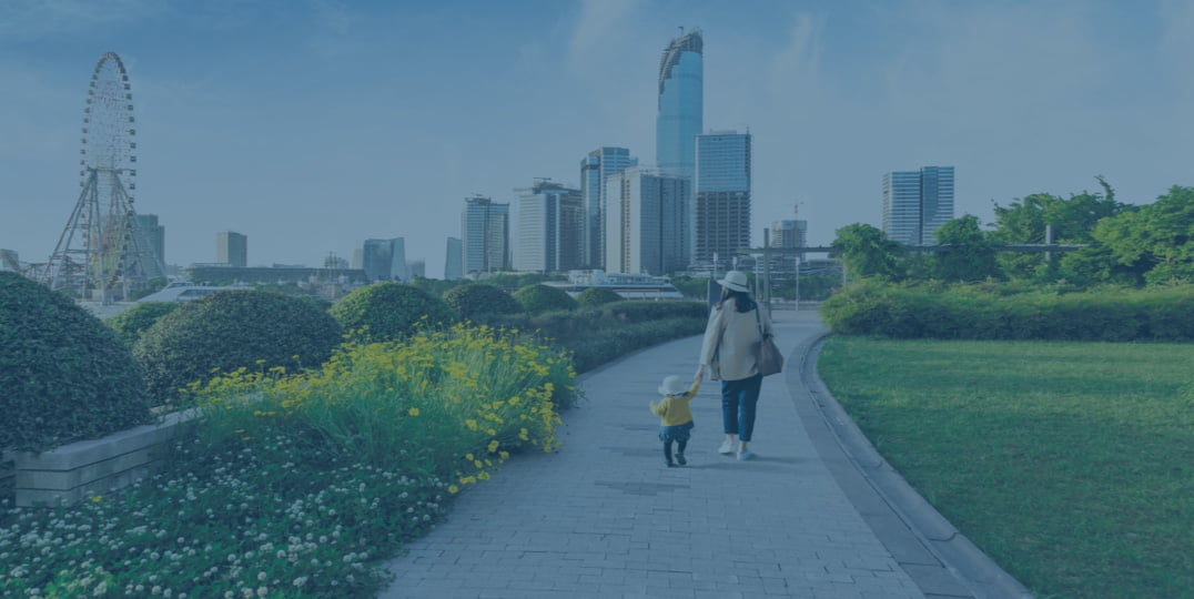 Family walking towards city