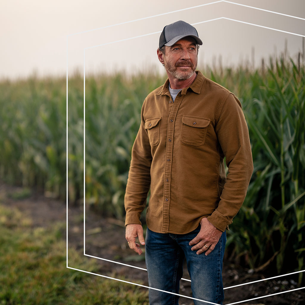 Farmer standing in his field.