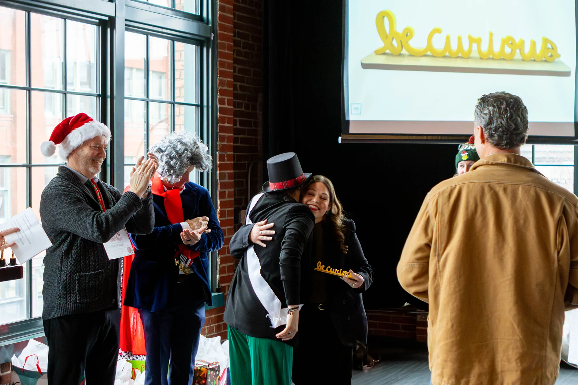 Kristen Kaestner receiving the "Be Curious" award.