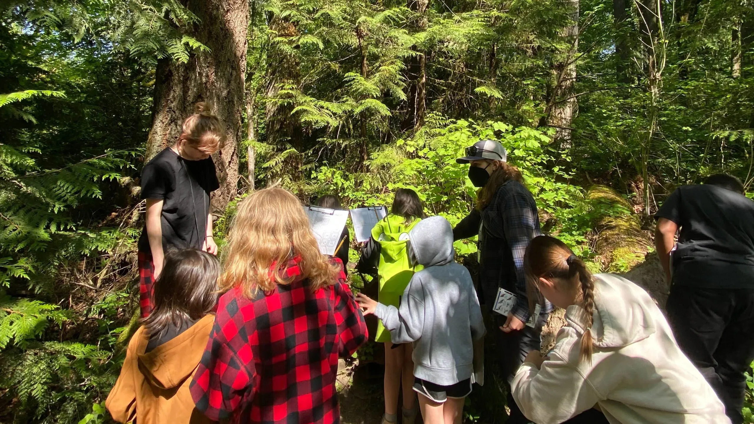 An HLK volunteer guiding fourth graders on a nature hike through Tryon Creek State Park in Portland, Oregon.