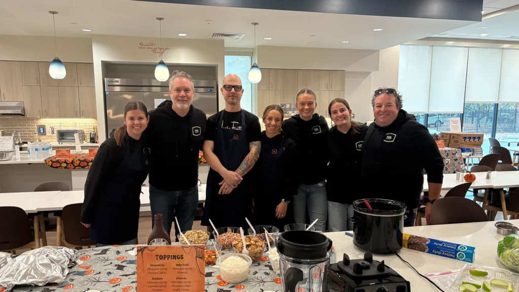 Seven HLK team members posing for a picture while volunteering.